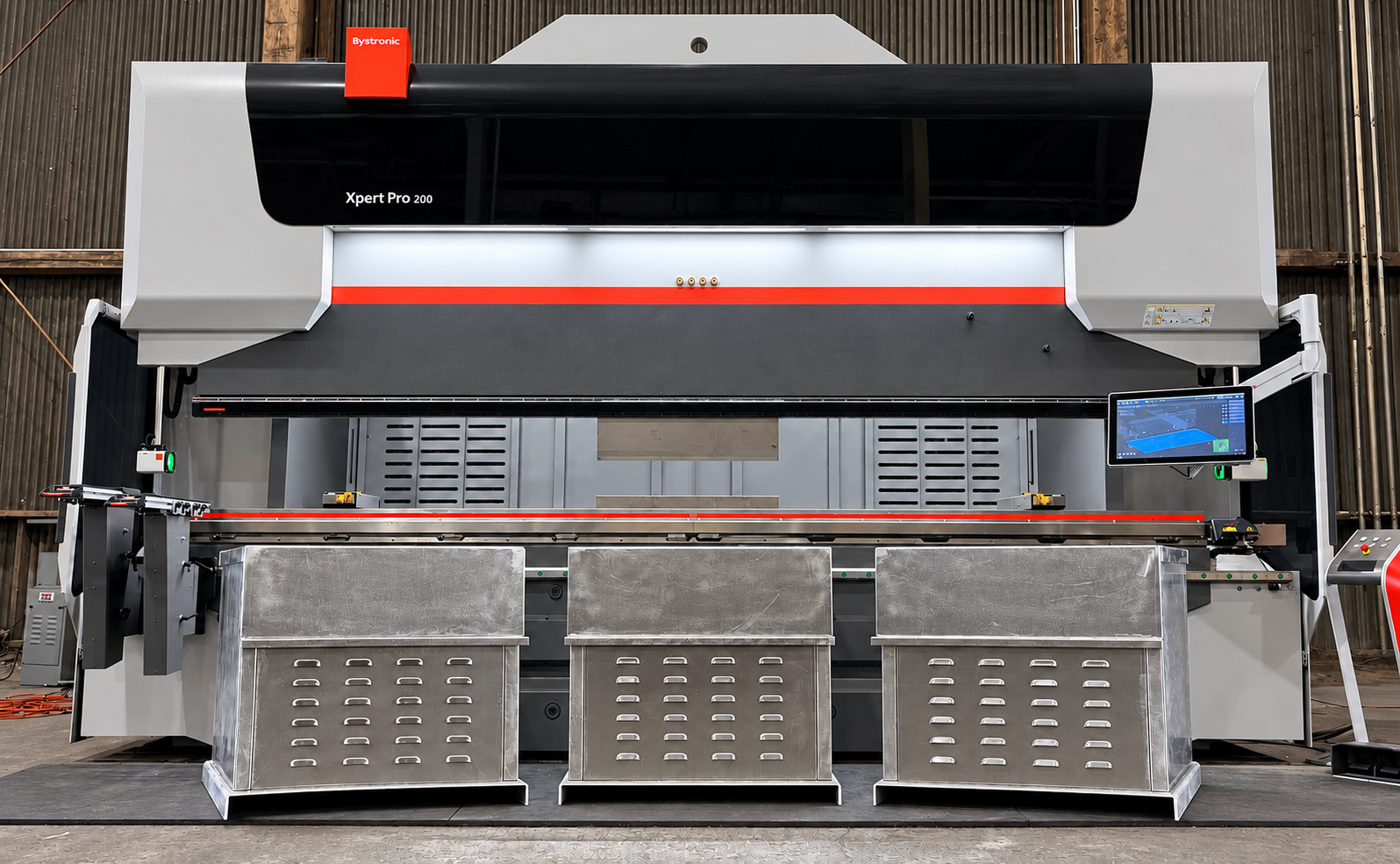 Three fabricated metal enclosures in front of the Forma Systems press brake